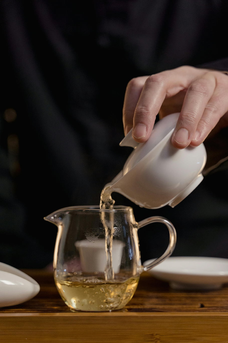 hand-holding-gaiwan-pouring-tea-ceramic-gaiwan-glass-teapot-green-tea-cha-hai-traditional-tea-ceremony-tea-pouring-tea-ceremony-tea-preparation.jpg hand-holding-gaiwan-pouring-tea-ceramic-gaiwan-glass-teapot-green-tea-cha-hai-traditional-tea-ceremony-tea-pouring-tea-ceremony-tea-preparation.jpg